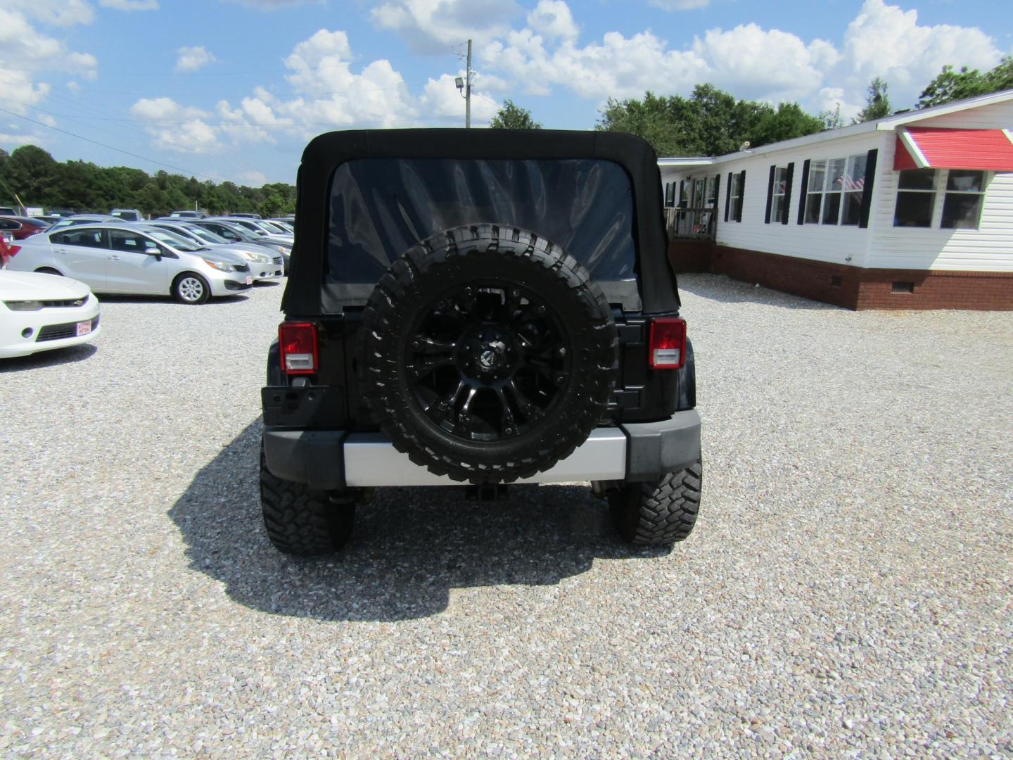 2015 Black /Tan Jeep Wrangler (1C4HJWEG4FL) with an V6 engine, Automatic transmission, located at 15016 S Hwy 231, Midland City, AL, 36350, (334) 983-3001, 31.306210, -85.495277 - Photo#6